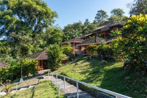 a house on the side of a hill at Bongo - Adults Only in Manuel Antonio