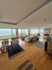 a large living room with a couch and a table at Penthouse Villa brava in Punta del Este