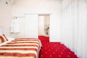 Postel nebo postele na pokoji v ubytování Art Hotel