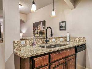 a kitchen with a sink and a counter at Large Plaza 2BR BTH in Kansas City
