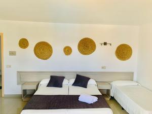 Postel nebo postele na pokoji v ubytování Hotel LLITERAS