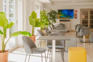 TV a/nebo společenská místnost v ubytování Hotel LLITERAS
