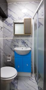 a bathroom with a sink and a toilet at Sleek 3Bed/3Bathroom Flat@Harrow in Hatch End