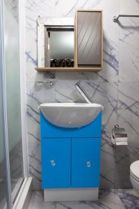 a bathroom with a sink and a mirror at Sleek 3Bed/3Bathroom Flat@Harrow in Hatch End