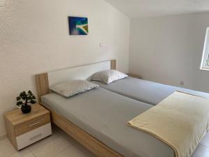 Postel nebo postele na pokoji v ubytování Apartmani Filip