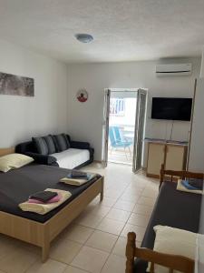 Postel nebo postele na pokoji v ubytování Apartmani Filip