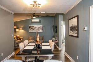 a dining room with a dining table and chairs at Youll Never Find A Bungalow Like Mine in Tampa