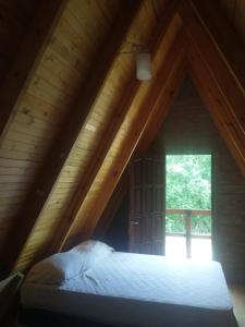 Postel nebo postele na pokoji v ubytování Cabana Alpina en La Granja