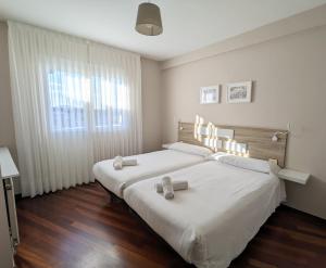 Postel nebo postele na pokoji v ubytování Apartamentos Turísticos Guillermo