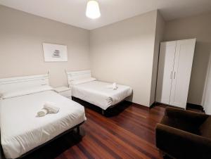 Postel nebo postele na pokoji v ubytování Apartamentos Turísticos Guillermo
