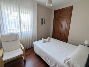 Postel nebo postele na pokoji v ubytování Apartamentos Turísticos Guillermo