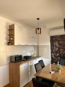 Kuchyň nebo kuchyňský kout v ubytování Afrodita apartman + 7 fotografií