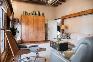 a living room with a couch and a table and chairs at Sweet Lancaster Apt. B in Lancaster