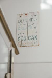 a piece of paper with writing on a wall at Hotel LLITERAS in Cala Ratjada