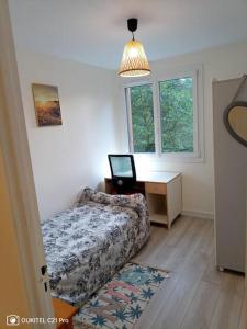 Ένα ή περισσότερα κρεβάτια σε δωμάτιο στο Chambre lumineuse bords de marne - Paris disneyland