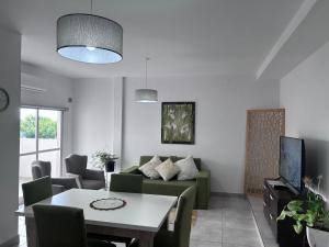 a living room with a couch and a table at Apart Luro III in Santa Rosa