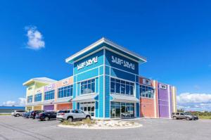 a building with cars parked in a parking lot at North Lost Key Landing 2B in Pensacola