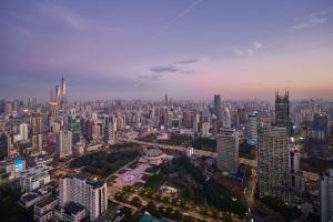 an aerial view of a large city with tall buildings at JW Marriott Shanghai at Tomorrow Square in Shanghai