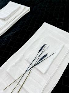 a pair of chopsticks sitting on top of white napkins at Black&White mountain - ADULTS ONLY in Petroşani
