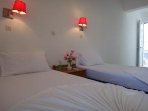 Posteľ alebo postele v izbe v ubytovaní Amfi Apartments
