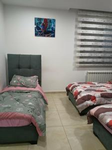 Кровать или кровати в номере Appartement lux vue sur mer