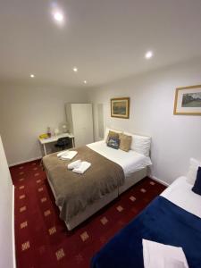 เตียงในห้องที่ Comfy Bedrooms near Euston Station - 1 Exmouth