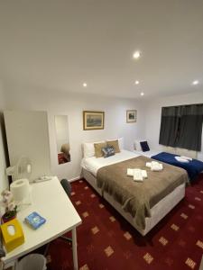 Kama o mga kama sa kuwarto sa Comfy Bedrooms near Euston Station - 1 Exmouth