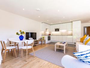 a living room and kitchen with a table and a couch at 2 Bed in Croyde 76783 in Croyde