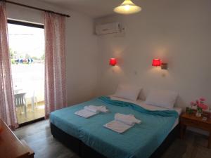 Posteľ alebo postele v izbe v ubytovaní Amfi Apartments