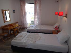 Posteľ alebo postele v izbe v ubytovaní Amfi Apartments