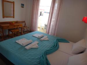 Posteľ alebo postele v izbe v ubytovaní Amfi Apartments