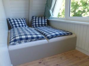Postel nebo postele na pokoji v ubytování Holiday home Sehnsucht Schlei