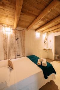 Ein Bett oder Betten in einem Zimmer der Unterkunft Casinha do Rio