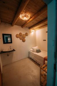 En eller flere senger på et rom på Casinha do Rio