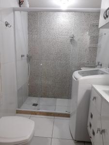 a bathroom with a shower and a toilet and a sink at Apto lapa in Rio de Janeiro