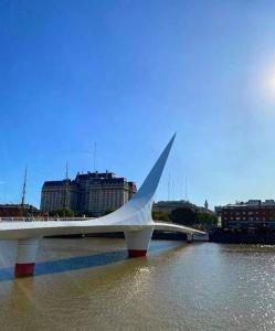 a white bridge in the middle of a river at La Casa de Malena in Buenos Aires