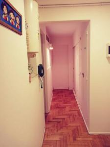 an empty hallway with a wooden floor in a room at La Casa de Malena in Buenos Aires