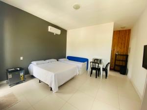 Ein Bett oder Betten in einem Zimmer der Unterkunft Suíte privativa próxima ao Sesc 1
