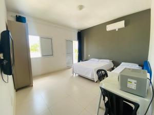 Ein Bett oder Betten in einem Zimmer der Unterkunft Suíte privativa próxima ao Sesc 1