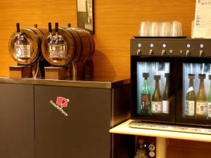 a machine with bottles of wine on a counter at Hotel Nikko Nara in Nara