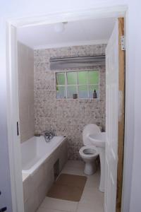 Vonios kambarys apgyvendinimo įstaigoje Kanana Villas