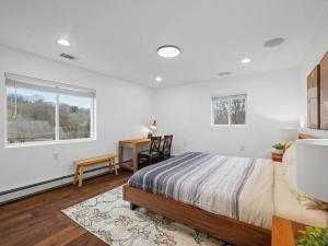 a bedroom with a bed and a desk and a window at Modern and Accessible 5 Bedroom Home in Wexford/Pittsburgh with Private Pool in Wexford