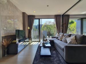 a living room with a couch and a table at Relaxing 2 Bedroom in Khaoyai in Ban Huai Sok Noi