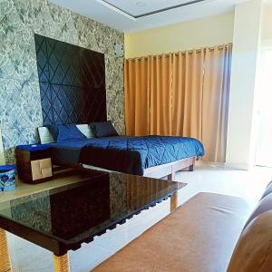 מיטה או מיטות בחדר ב-Hotel glassy