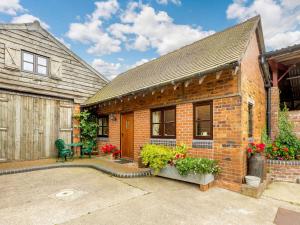 a brick house with a patio in front of it at 1 Bed in Telford 89144 in Leighton