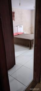 a view of a bedroom with a bed in a room at Mi casa in Chuy
