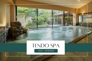 a swimming pool in a house with a hot spring at Ichiraku tendo spa & brewery in Tendo +173 photos