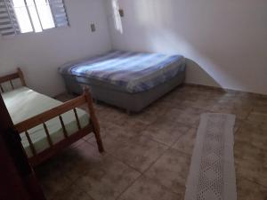 מיטה או מיטות בחדר ב-Casa de campo Maciel
