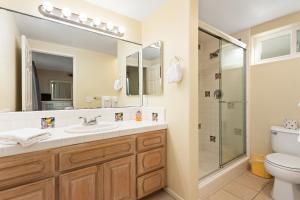 a bathroom with a sink and a shower at Oceanfront Family Getaway - BBQ - Oceanfront Seating in Oceanside