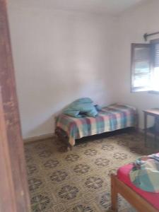 Uma cama ou camas num quarto em Piriápolis a 4 cuadras de playa,"Las Hortensias"